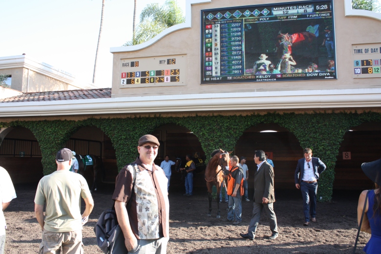 Fresh off the plane from Boston, Ed Collins eyeballs the paddock prospects before the $300,000 Del Mar Futurity on Sept. 4. 